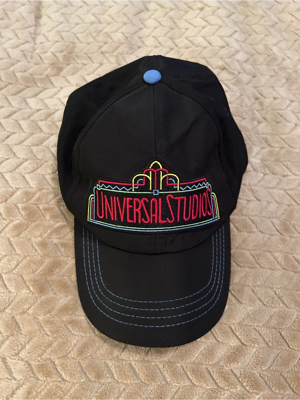 Universal Black Baseball Cap with White Text and Red Accent